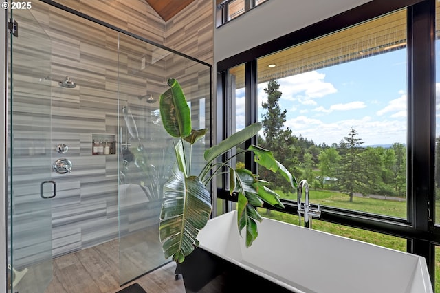 11440 NW Rock Creek Rd, Portland, OR 97231 - bathroom featuring a stall shower, plenty of natural light, and a soaking tub