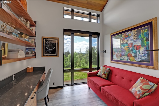 11440 NW Rock Creek Rd, Portland, OR 97231 - home office featuring high vaulted ceiling, wood finished floors, and built in desk