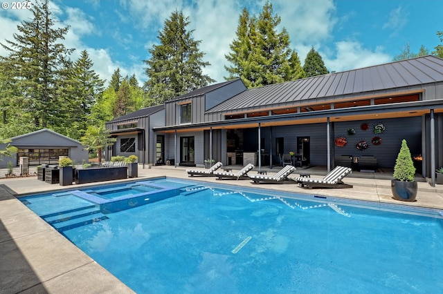 11440 NW Rock Creek Rd, Portland, OR 97231 - view of swimming pool featuring a patio area and a pool with connected hot tub