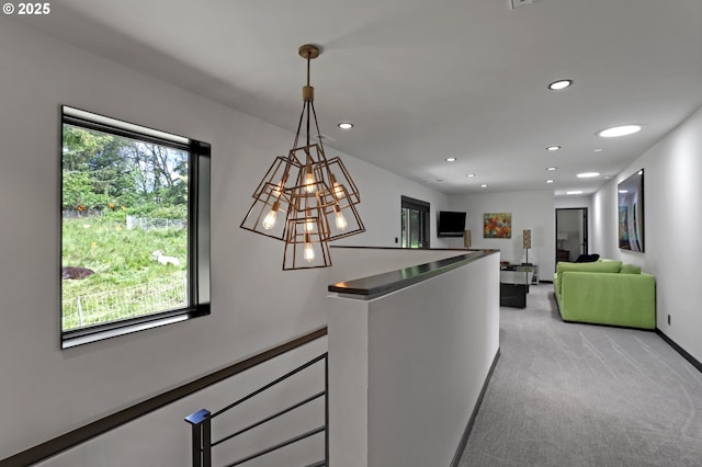 11440 NW Rock Creek Rd, Portland, OR 97231 - hall featuring an upstairs landing, light carpet, recessed lighting, a chandelier, and baseboards