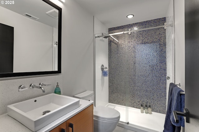 11440 NW Rock Creek Rd, Portland, OR 97231 - bathroom featuring toilet, a stall shower, vanity, and recessed lighting