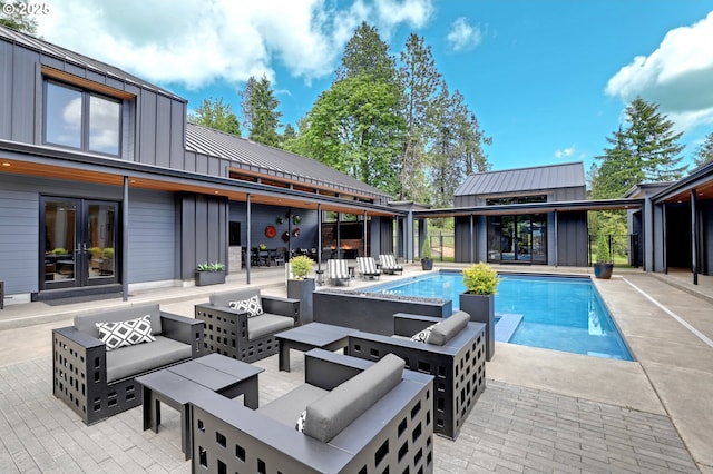 11440 NW Rock Creek Rd, Portland, OR 97231 - swimming pool with an outdoor living space, french doors, and a patio