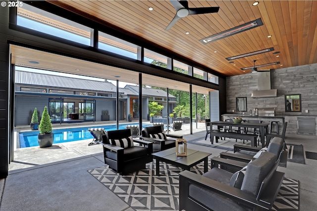 11440 NW Rock Creek Rd, Portland, OR 97231 - view of patio / terrace featuring a ceiling fan, an outdoor kitchen, an outdoor living space, and an indoor pool