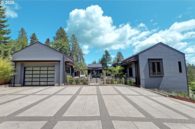 11440 NW Rock Creek Rd, Portland, OR 97231 - view of front of home featuring concrete driveway and an attached garage
