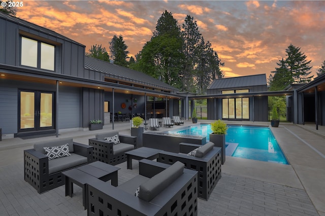 11440 NW Rock Creek Rd, Portland, OR 97231 - pool at dusk with an outdoor pool, an outdoor hangout area, and a patio