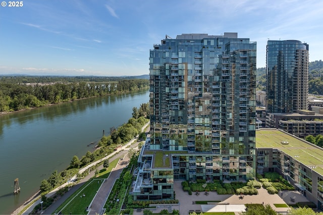 birds eye view of property with a water view