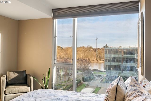 bedroom featuring a water view