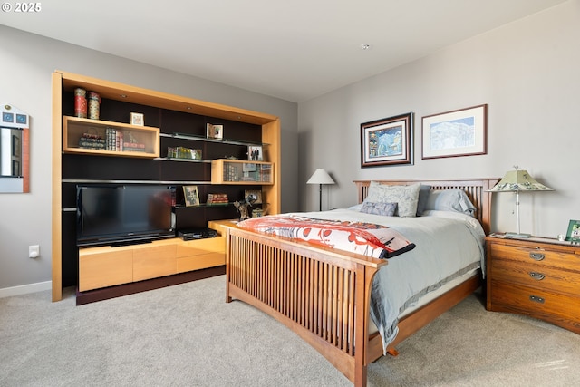 bedroom featuring light colored carpet