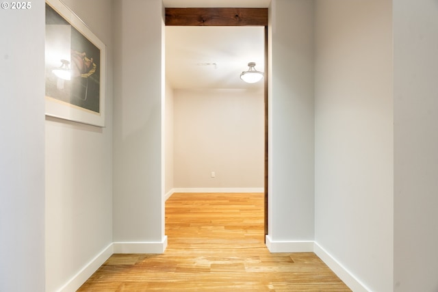 corridor featuring hardwood / wood-style floors