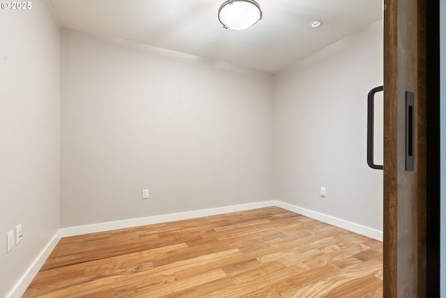 spare room featuring light wood-type flooring