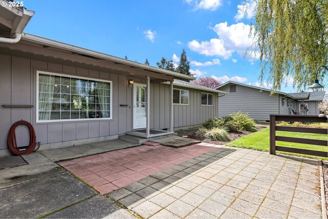 exterior space with a patio and board and batten siding