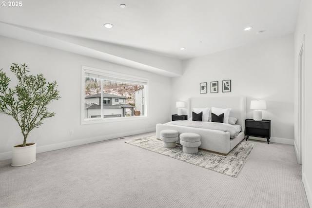 bedroom featuring light carpet