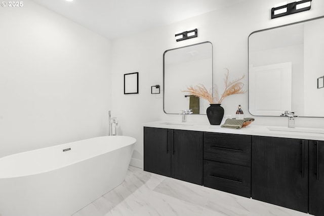 bathroom featuring vanity and a tub to relax in