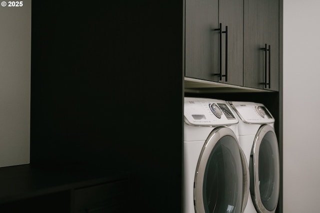 washroom with cabinets and independent washer and dryer