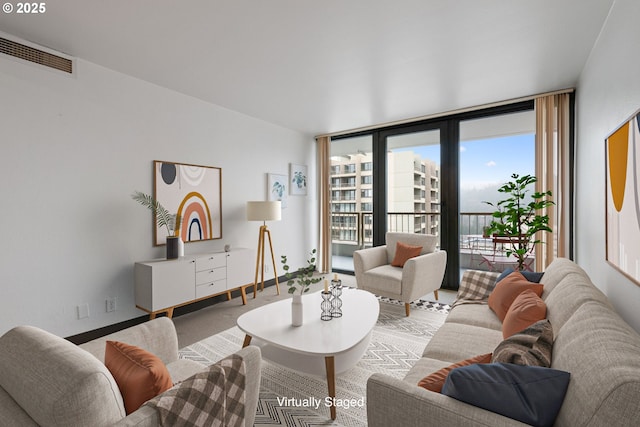 living room with a wall of windows and carpet floors