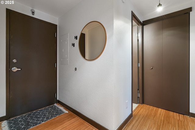 entryway featuring light hardwood / wood-style flooring and electric panel