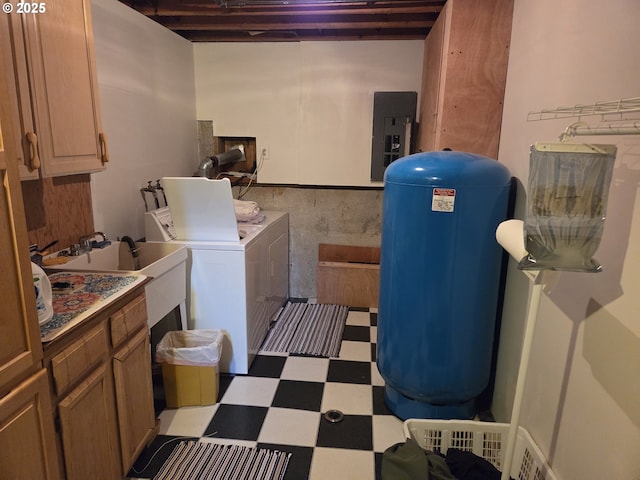 laundry area with electric panel, cabinet space, tile patterned floors, and washing machine and clothes dryer