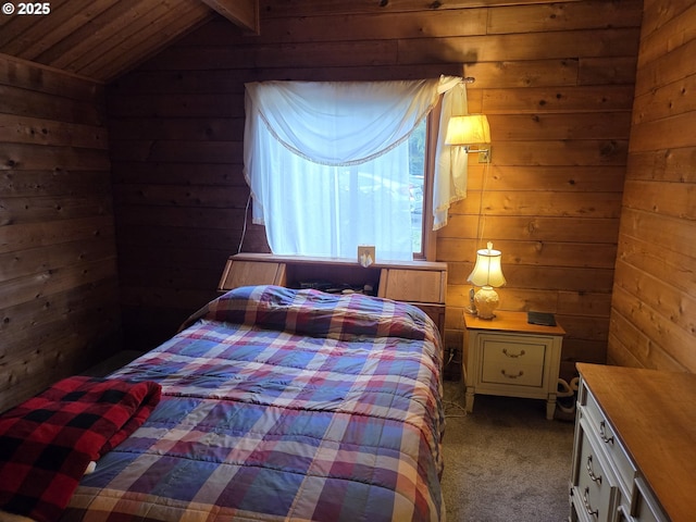 bedroom featuring wood walls, carpet, and vaulted ceiling