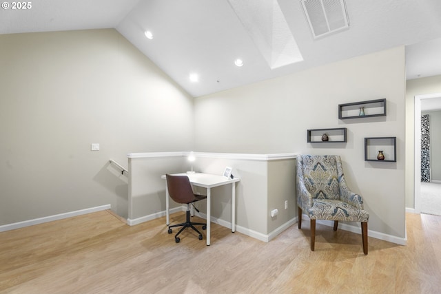 office area featuring lofted ceiling and light hardwood / wood-style flooring