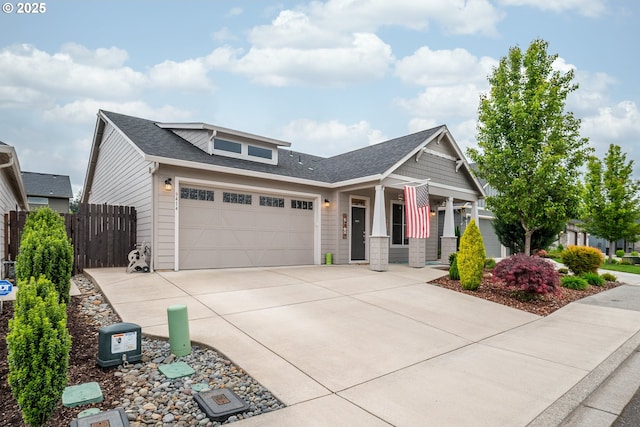 9414 NE 166th Ave, Vancouver, WA 98682 - craftsman-style house featuring concrete driveway, a garage, covered porch, fence, and roof with shingles