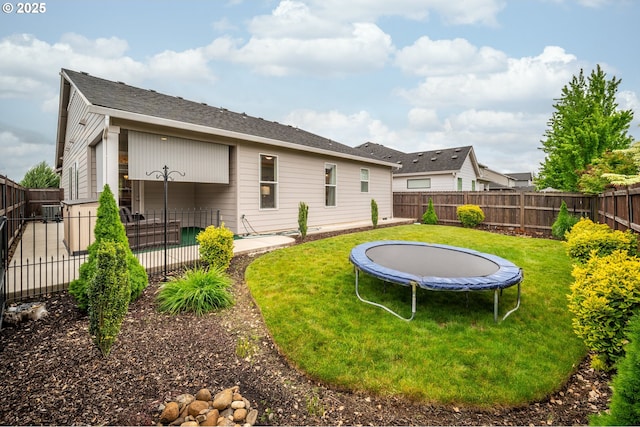 9414 NE 166th Ave, Vancouver, WA 98682 - back of house with a trampoline and a patio area