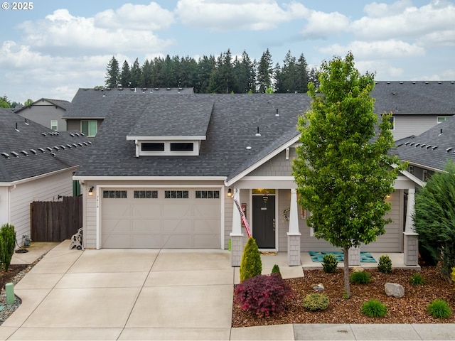 9414 NE 166th Ave, Vancouver, WA 98682 - craftsman house featuring driveway, roof with shingles, fence, and an attached garage