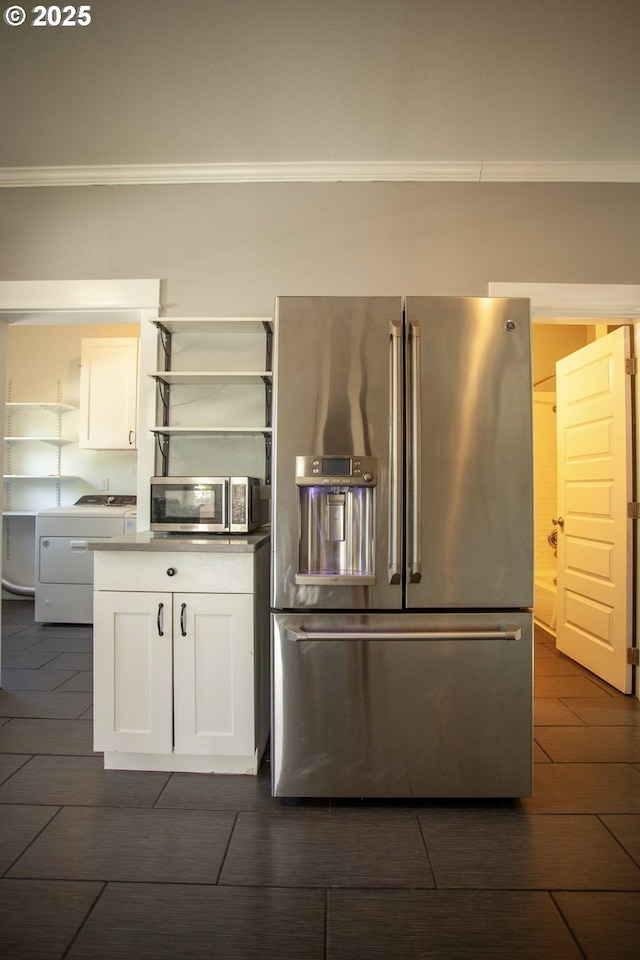kitchen with stainless steel appliances, open shelves, washer / clothes dryer, ornamental molding, and white cabinets