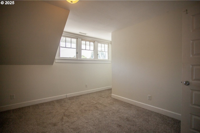 unfurnished room with baseboards and carpet flooring