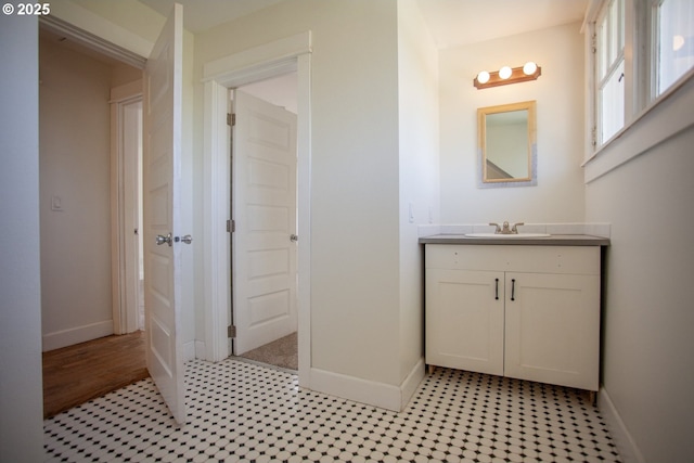 bathroom with baseboards and vanity
