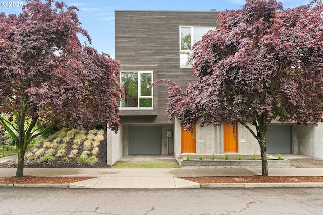 435 N Shaver St, Portland, OR 97227 - view of front facade with concrete driveway and an attached garage