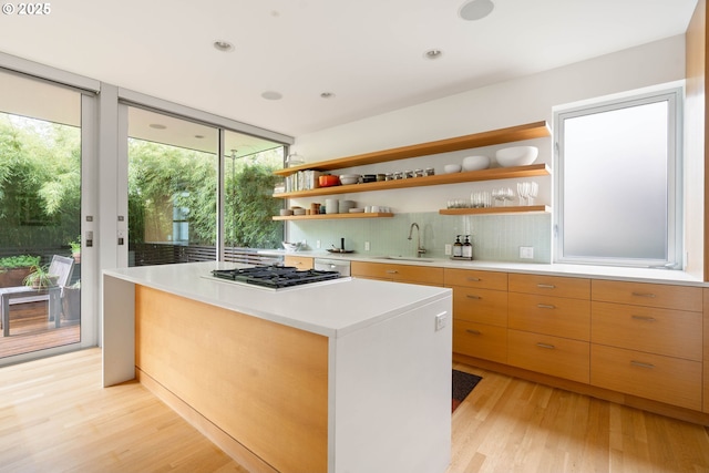 435 N Shaver St, Portland, OR 97227 - kitchen with a sink, open shelves, gas cooktop, light wood finished floors, and recessed lighting