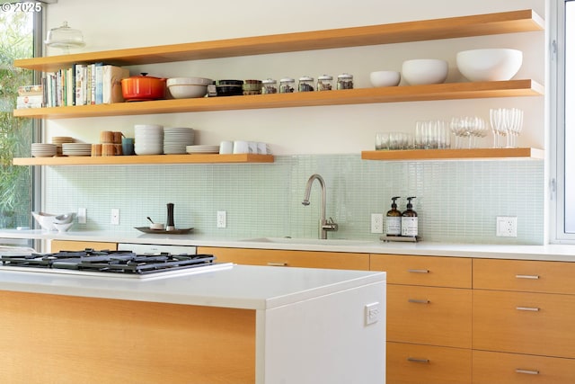 435 N Shaver St, Portland, OR 97227 - kitchen with open shelves, decorative backsplash, a sink, gas stovetop, and light countertops