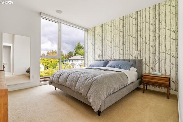 435 N Shaver St, Portland, OR 97227 - bedroom featuring light colored carpet and floor to ceiling windows