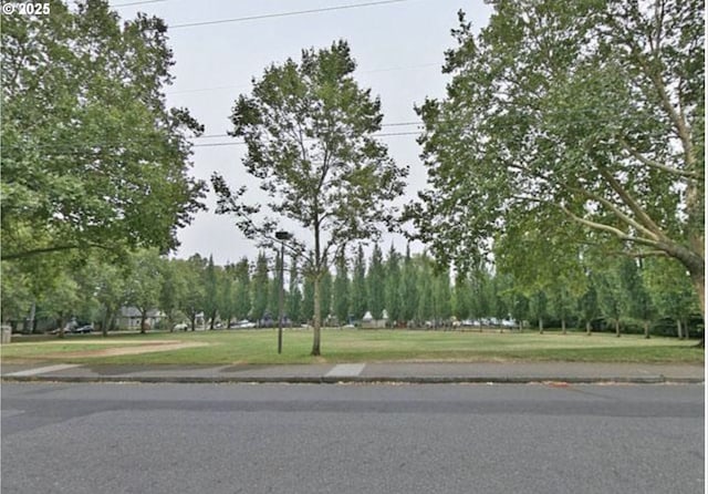 435 N Shaver St, Portland, OR 97227 - view of asphalt road featuring curbs and sidewalks