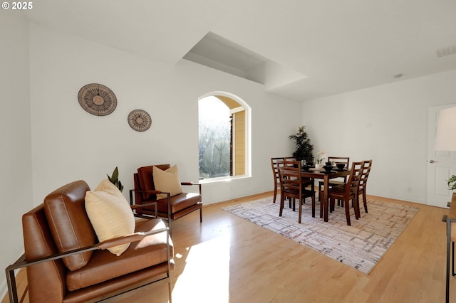 dining room with light wood-type flooring and visible vents