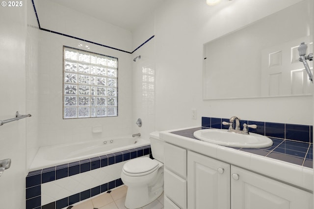 full bathroom featuring tiled shower / bath combo, tile patterned flooring, toilet, and vanity