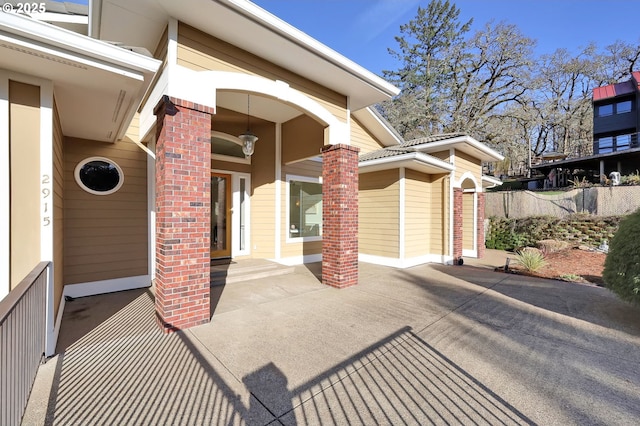 property entrance with a patio area