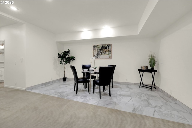 dining area featuring marble finish floor, baseboards, and recessed lighting