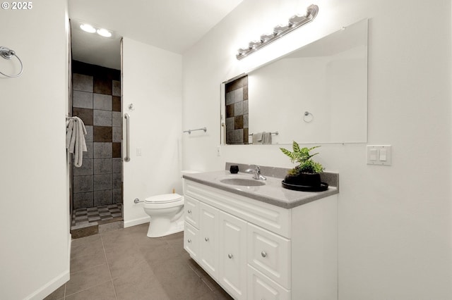 full bathroom with toilet, vanity, baseboards, tile patterned floors, and walk in shower