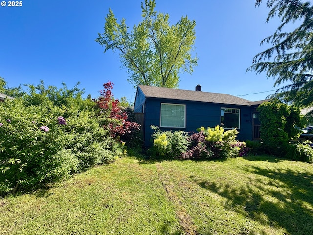 1790 W 18th Ave, Eugene, OR 97402 - view of side of home with a lawn and a chimney