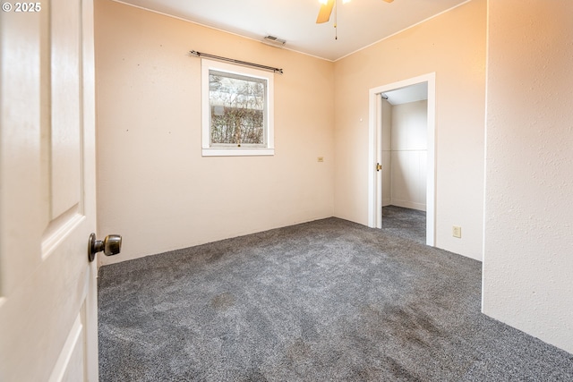 unfurnished bedroom featuring visible vents, ceiling fan, and carpet floors