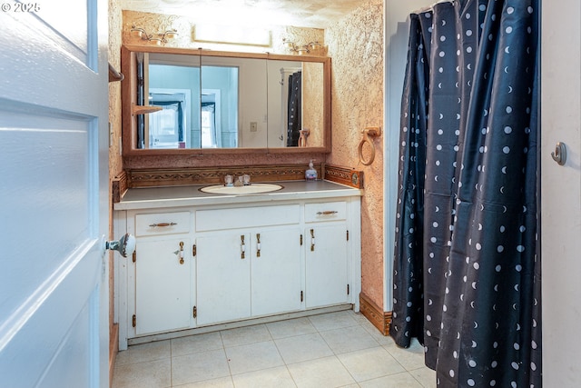 bathroom with tile patterned floors and vanity