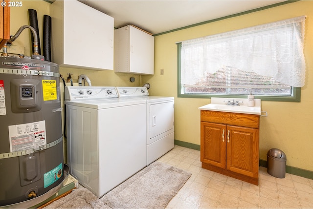 washroom with light floors, secured water heater, cabinet space, a sink, and washer and dryer