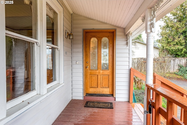 view of exterior entry featuring a porch