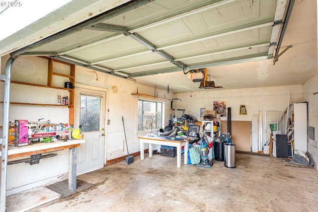 garage featuring a workshop area and a garage door opener