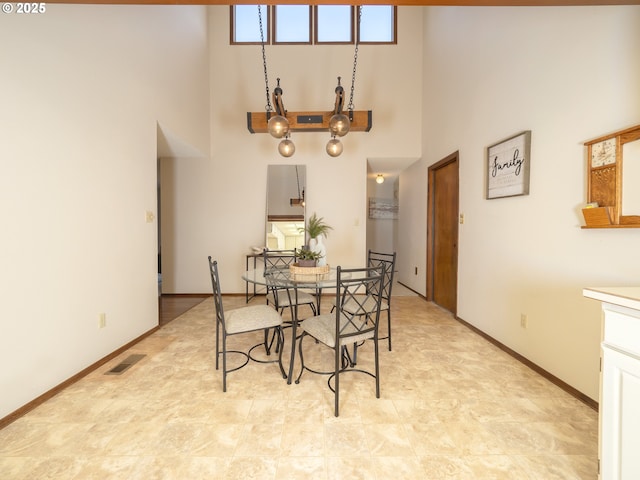 dining space with a high ceiling