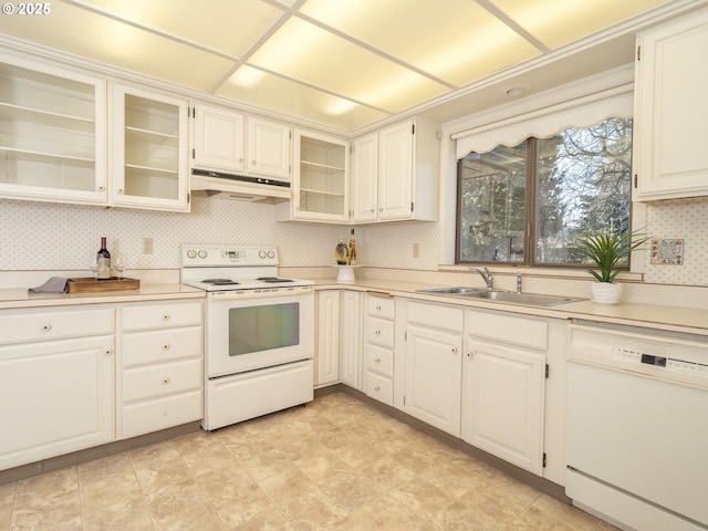 kitchen featuring sink, white appliances, and white cabinets