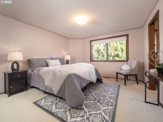 carpeted bedroom featuring a textured ceiling