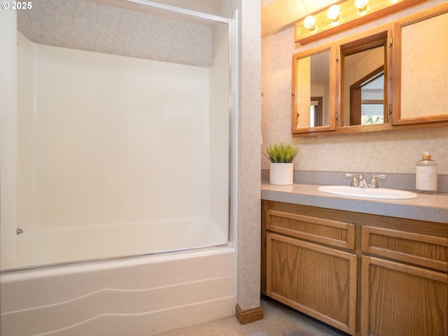 bathroom featuring vanity and shower / bath combination with glass door