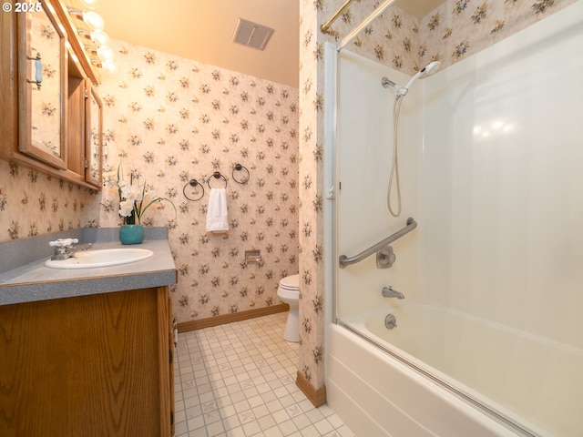 full bathroom with vanity, tile patterned floors, toilet, and washtub / shower combination